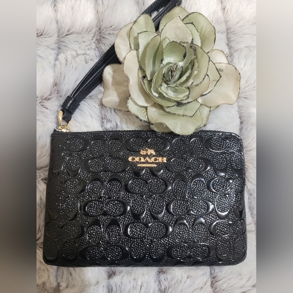 Coach Handbags - 2/$40 NWOT..Patent Leather.Coach Wristlet  Black ..with Embossed Seal NWOT